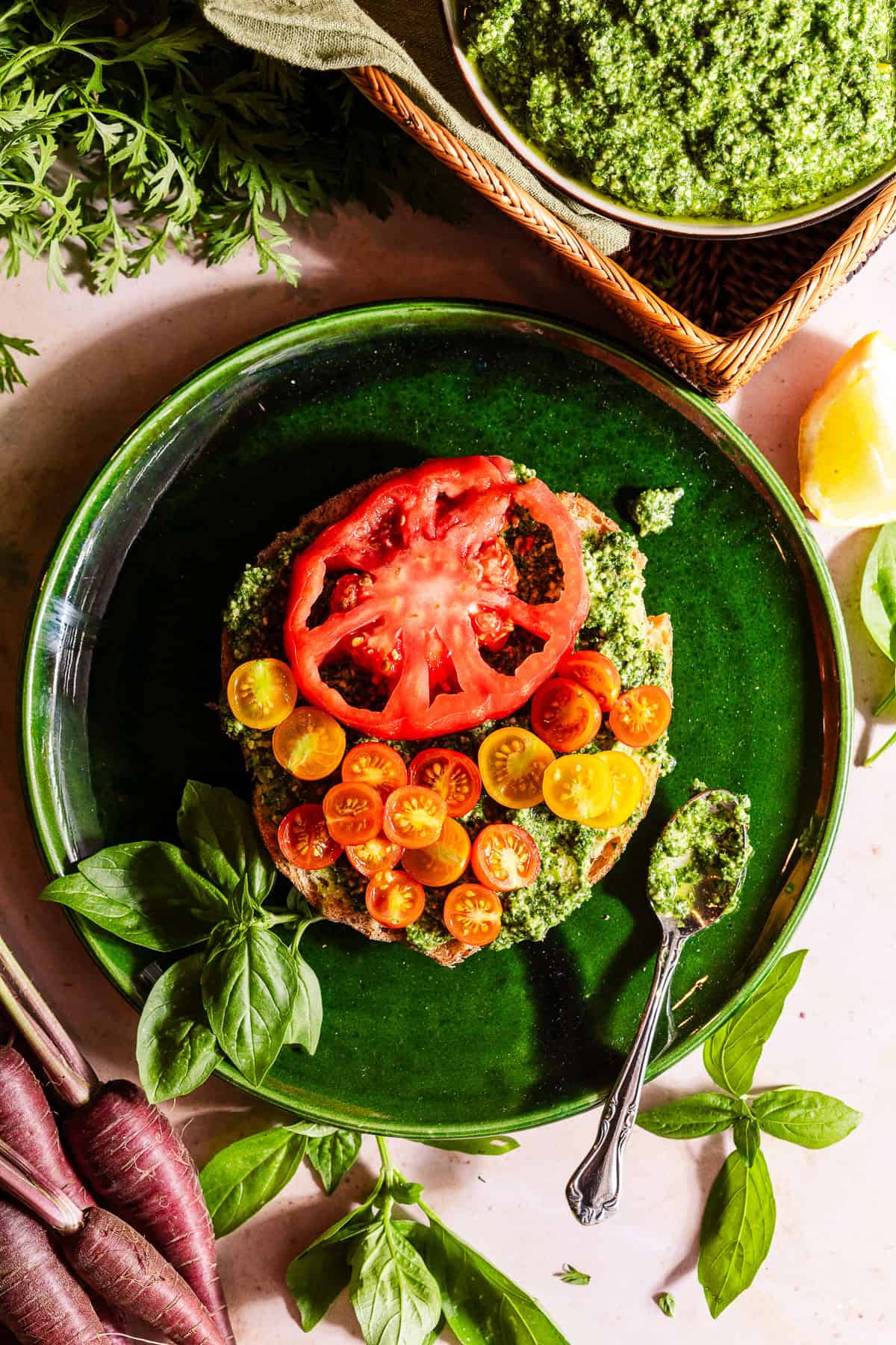 Toasted sourdough topped with pesto and tomatoes.