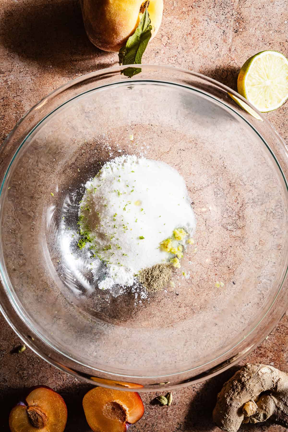 Sugar, cornstarch, and other galette ingredients unmixed in a bowl.
