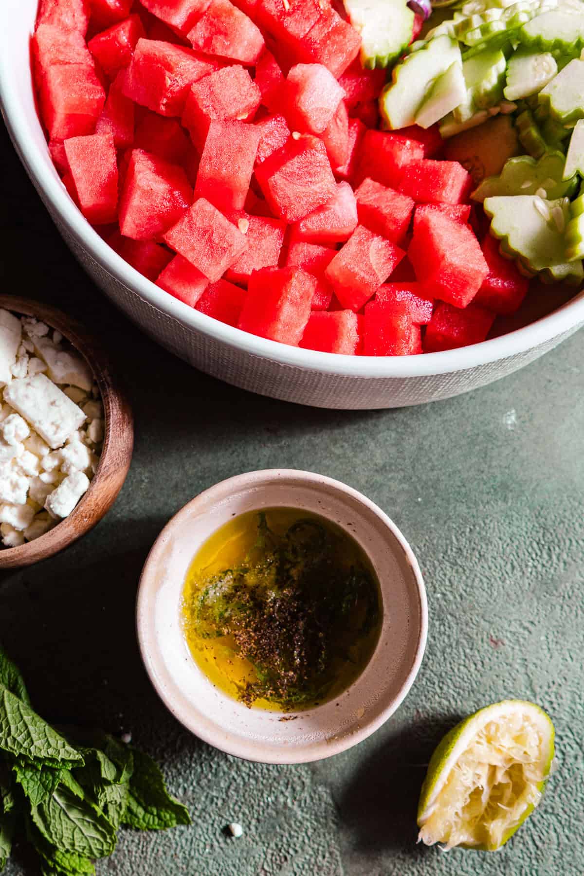 A citrus juice and olive oil dressing for the watermelon feta salad.