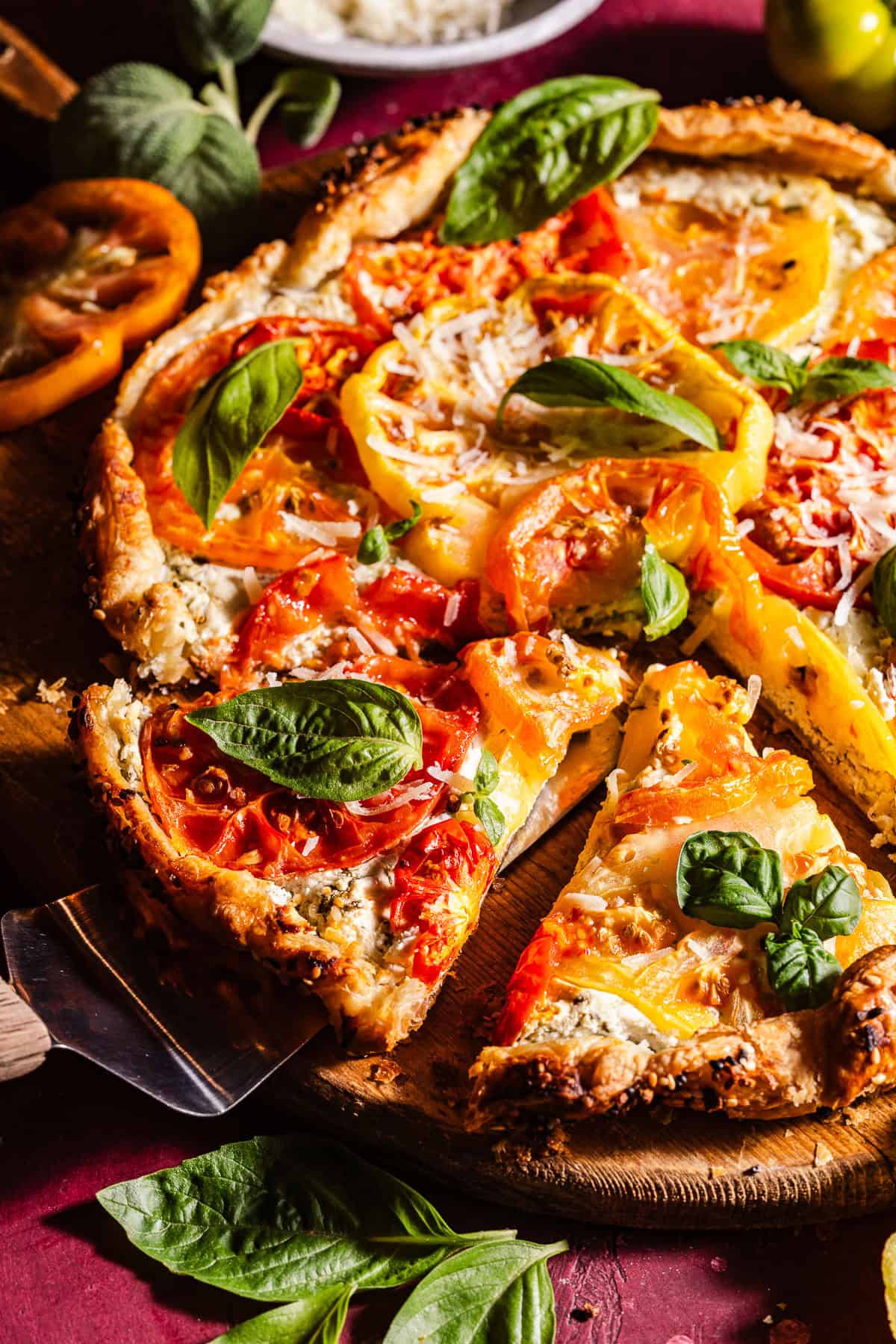 Sliced tomato galette with basil.