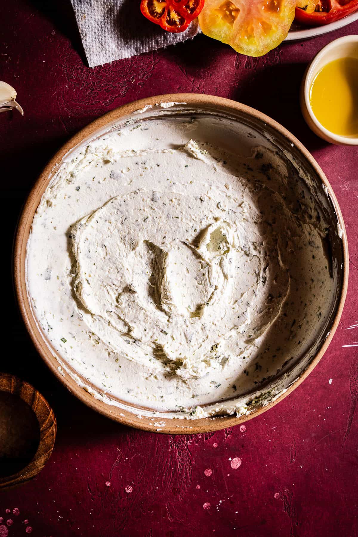 Bowl full of herbed goat cheese.